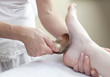 physical therapist practising a kansu foot massage