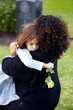 Looking for comfort in her mother's arms