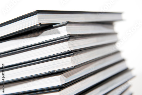 Photo: pile of books on white background pile of books on white background