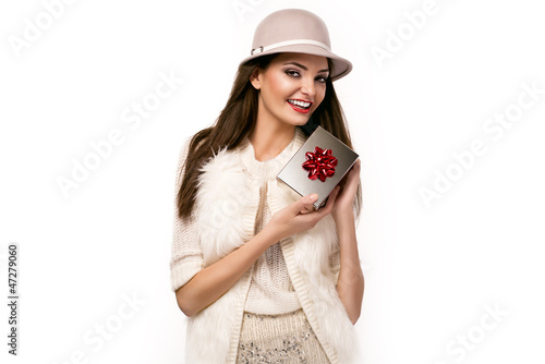 Photo: christmas picture of elegant woman holding a present christmas picture of elegant woman holding a present
