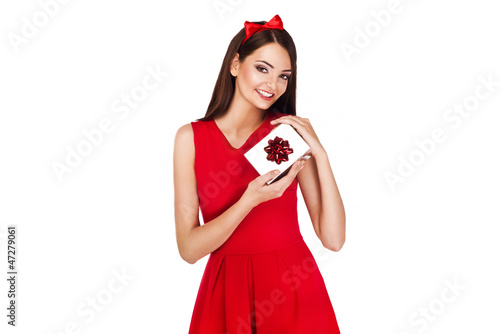 Photo: christmas picture of elegant woman holding a present christmas picture of elegant woman holding a present