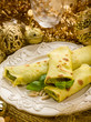 pesto crepes over golden christmas table