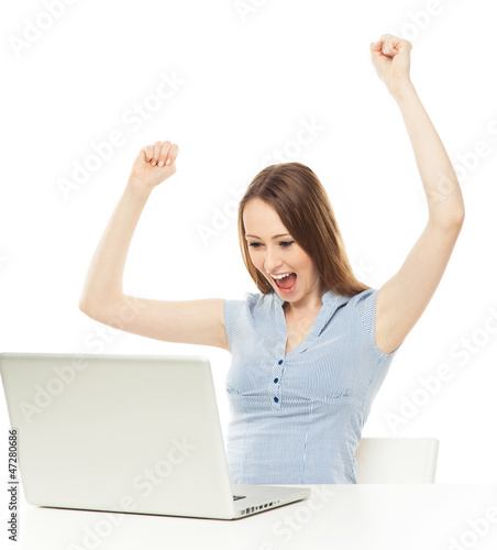 Photo: Excited woman with laptop Excited woman with laptop