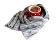 Cup of cocoa wrapped in grey scarf