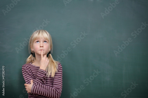 Photo: Girl at the Blackboard Thinking Girl at the Blackboard Thinking