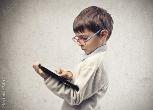 Photo: Child with the Tablet Child with the Tablet