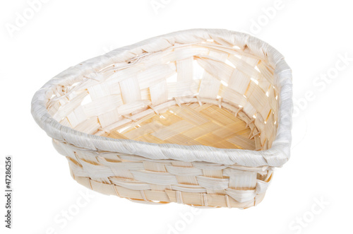 Photo: Wickerwork empty yellow breadbasket on white background Wickerwork empty yellow breadbasket on white background