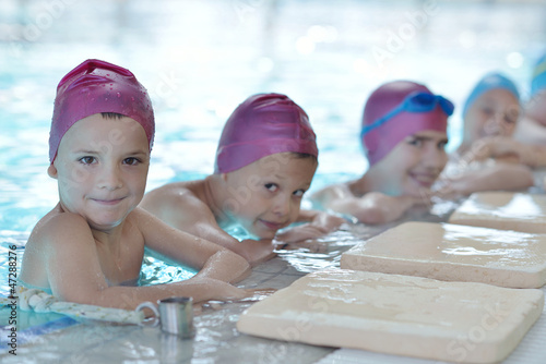 Photo: happy children group at swimming pool happy children group at swimming pool