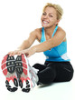 Beautiful atletic woman exercising on the floor