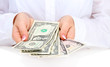American dollars in a women hands, close up