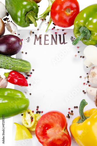 Photo: Menu surrounded by products and vegetables isolated on white Menu surrounded by products and vegetables isolated on white
