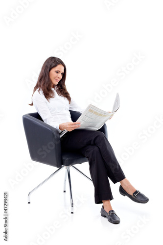 Photo: Casual 20s women reading newspaper Casual 20s women reading newspaper