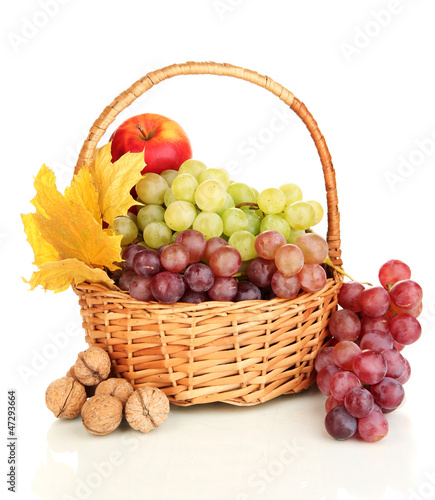 Photo: Grape in basket with nuts isolated on white Grape in basket with nuts isolated on white
