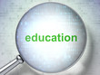 Magnifying optical glass with words education on digital backgro