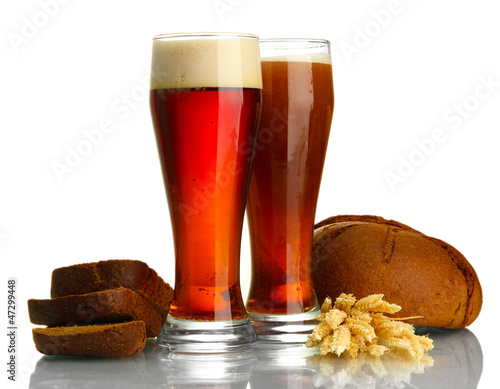 Photo: two glasses of kvass and rye breads with ears, isolated on two glasses of kvass and rye breads with ears, isolated on