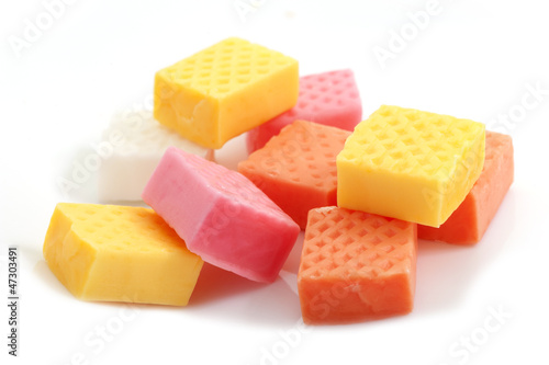 Photo: fruit caramel candy close-up on white background fruit caramel candy close-up on white background