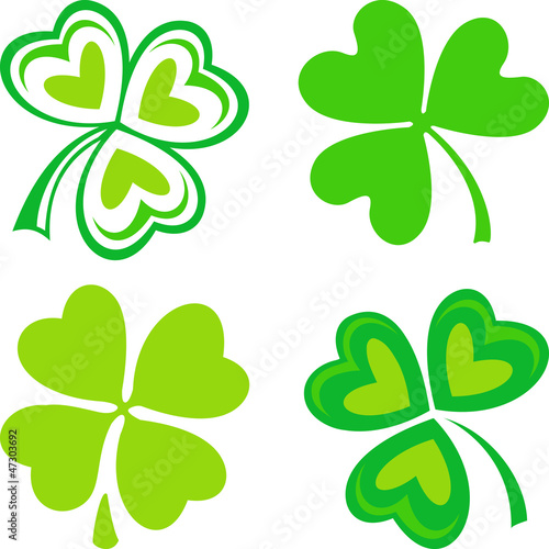 Vector: Isolated green ornamental Irish symbols - shamrocks Isolated green ornamental Irish symbols - shamrocks