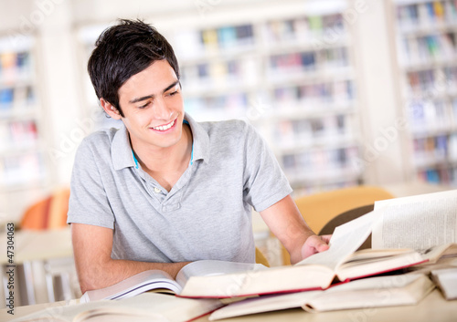Photo: Man studying at the library Man studying at the library