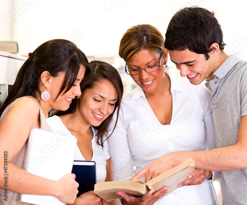 Photo: Students reading a book Students reading a book