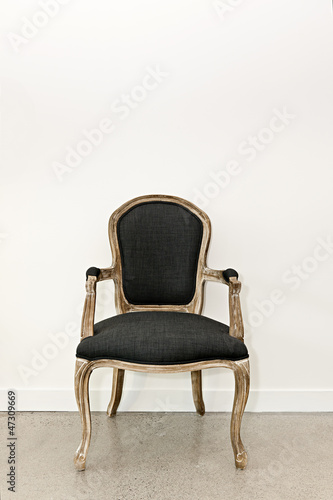 Photo: Antique armchair near wall Antique armchair near wall