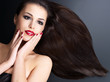 Beautiful woman with long brown straight hairs