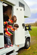 Happy kids inr camper (RV), family vacation trip in motorhome