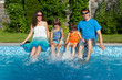 Family summer vacation, fun near swimming pool