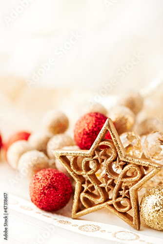 Photo: Close up of golden and red christmas decoration Close up of golden and red christmas decoration