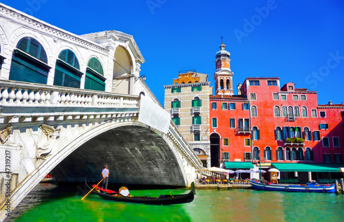 Photo: Famous Rialto bridge with Gondola in Venice, Italy Famous Rialto bridge with Gondola in Venice, Italy