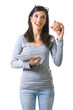 Saving, brunette young woman with a piggy bank