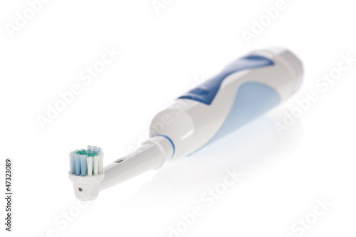 Photo: Electric toothbrush isolated on white background. Electric toothbrush isolated on white background.