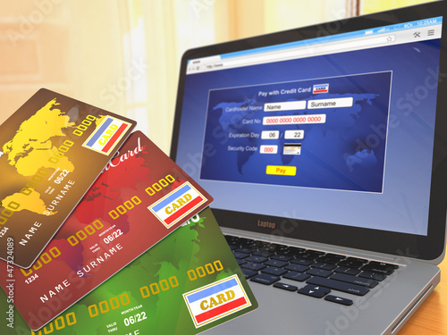 Illustration: E-commerce. Credit cards on laptop E-commerce. Credit cards on laptop