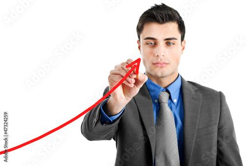 Photo: Businessman drawing a growing business graph isolated Businessman drawing a growing business graph isolated