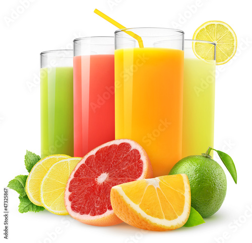 Isolated drinks. Glasses of fresh citrus juices (orange, grapefruit, lemon, lime) and cut fruits isolated on white background