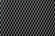 Photo: Metal grid on black background Metal grid on black background
