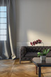 Grey Sofa Near Window With Curtains