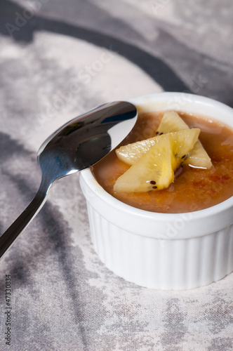 Photo: creme brulee with fresh slice fruits on top creme brulee with fresh slice fruits on top