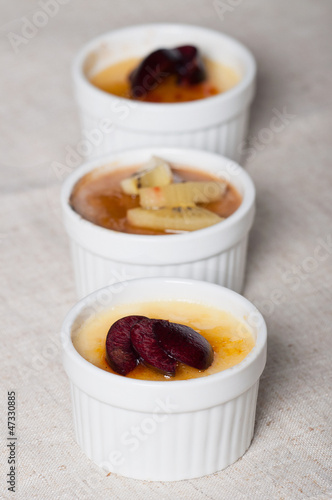 Photo: creme brulee with fresh slice fruits on top creme brulee with fresh slice fruits on top