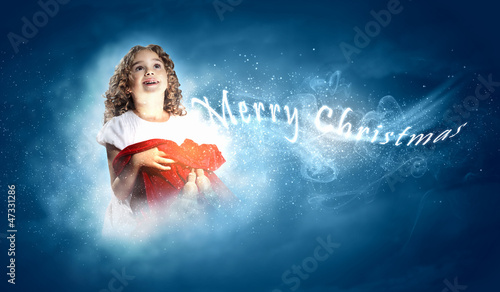 Photo: Happy girl opening gift box Happy girl opening gift box