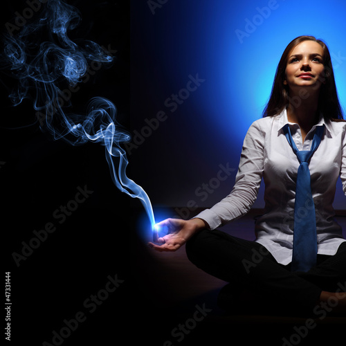 Photo: Business woman meditating Business woman meditating