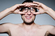 Funny portrait of a man with glasses, binoculars concept