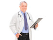 A mature doctor holding a clipboard