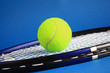 Tennis Racket And Ball On A Bl...