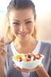 woman eating salad
