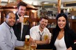 Happy fans watching TV in pub cheering