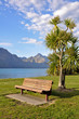 Photo: Wooden bench on side of Lake Wakatipu, Queenstown, New Zealand Wooden bench on side of Lake Wakatipu, Queenstown, New Zealand