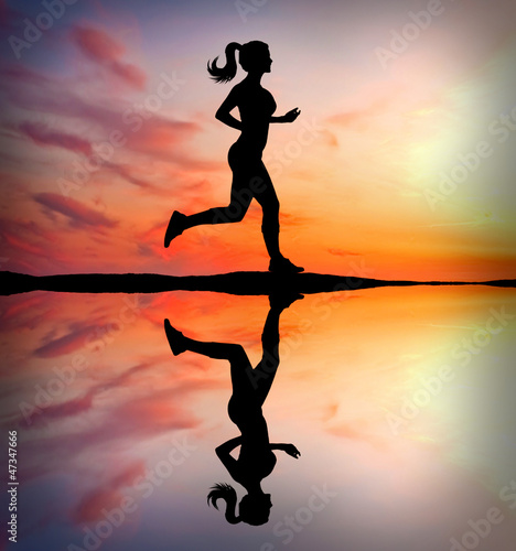 Photo: Woman running in the morning Woman running in the morning