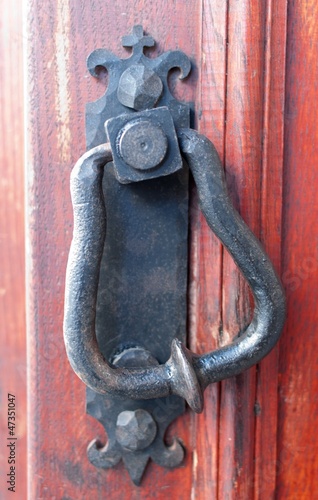 Photo: an old metal door handle knocker an old metal door handle knocker