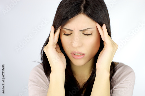 Photo: Beautiful woman with terrible headache Beautiful woman with terrible headache