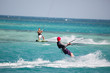 Kiteboarders enjoy surfing
